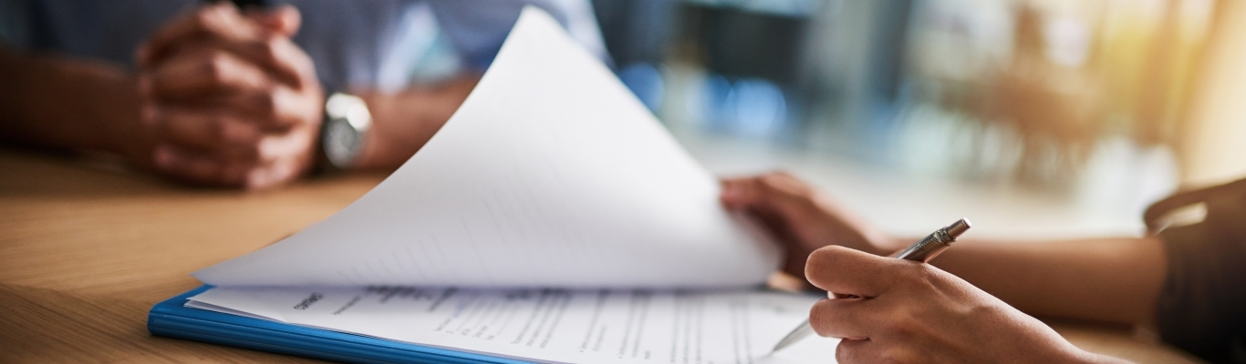 People at table looking through documents